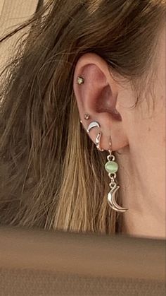 Stacked Stud Earrings, Ear Piercing Ideas Aesthetic Grunge, Silver Earrings Aesthetic Grunge, Green Tattoo Aesthetic, Ear Piercing Ideas Aesthetic Silver, Full Ear Piercings Aesthetic, Green Ear Piercings, Grunge Earrings Aesthetic, Bohemian Piercings