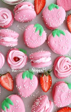 strawberry shortcakes with pink frosting and sprinkles