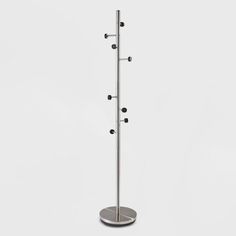 a metal pole with three balls on it and two hooks attached to the top one