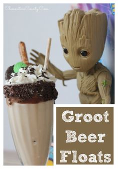 a groote beer float with whipped cream and chocolate toppings on it, next to a toy rocketon