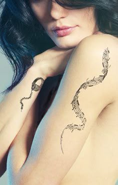 a woman with a tattoo on her arm