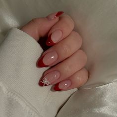 french nails with red tips and bows #naildesign Red French Bow Nails, Christmas Nail Ideas French Tips, Nail Inspo Red French Tip, Almond Nails With Red Tips, Christmas Nails Inspiration Simple, Simple French Christmas Nails, Clean Girl Nails Christmas