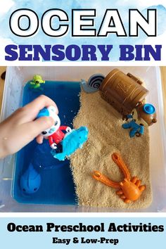 Pin text reads, Ocean sensory bin ocean preschool activities easy & low-prep and the image shows one of them that features blue jello and edible sand.