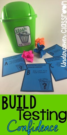 a green bucket and some blue cards with the words build testing confidence in front of it