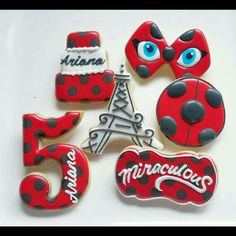 decorated cookies in the shape of numbers with ladybug and eiffel tower