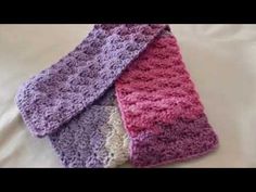 three crocheted scarves laying on top of each other