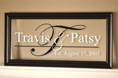 a framed sign that says travis and patsy on top of a fireplace mantel