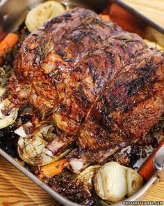 a roasting pan filled with meat and vegetables