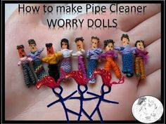 an image of how to make pipe cleaner worry dolls on the palm of someone's hand