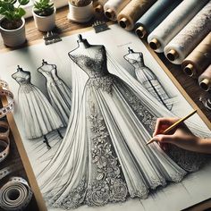 a drawing of a wedding dress on top of a table next to rolls of thread