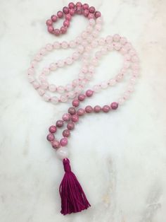 Rose quartz and rhodonite mala. 108 8mm beads. When this strand is worn doubled it appears to me as though the strands have been “dipped” in a dye that changes Mala Beads Diy, Mala Jewelry, Diamond Choker Necklace, Mala Bead Necklace, Dainty Diamond Necklace, 8mm Beads, Butterfly Pendant Necklace, Colour Blocking, Mala Necklace