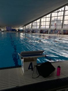 an empty swimming pool with people in it