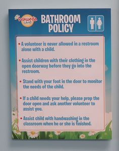 a bathroom policy sign hanging on the wall above a toilet stall door in a children's restroom