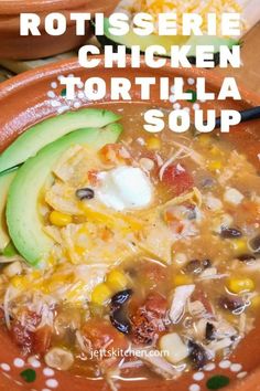 a bowl of tortilla soup with an avocado on the side