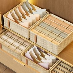 the drawers are filled with many different types of folded paper and other things in them