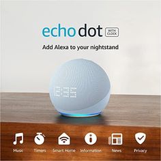 an echo dot device sitting on top of a wooden table