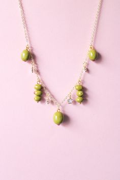 Please welcome the green olive charms necklace made of polymer clay. Get a matching pair of green olive earrings too as Spring/Summer is approaching. 👉🏼 Made to order  👉🏼 Hand sculpted charms 📐 Total Length: 20 inches (including 3 clasp holes for length adjustment) Due to the handmade nature of our products, there may be slight variations in color and/or craftsmanship. Copyright © 2024 Crafted by Levi. All rights reserved. Do not copy/use/reproduce our work without permission.  ⏳ [Processing Time]  All jewelry that are listed on our Etsy are ready in-stock unless noted otherwise. We typically process your order within 3-5 business days (exclude Saturday/Sunday/Holidays).  💖 [Care Instruction] Please store jewelry in a jewelry box to prevent scratch/breakage. Avoid contact with makeup