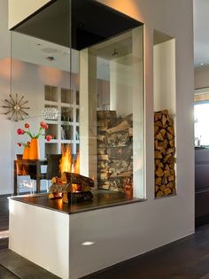 a fire place sitting in the middle of a living room