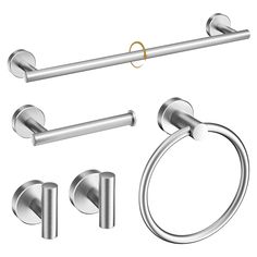 an assortment of bathroom accessories including toilet paper holder, towel ring, and two rings