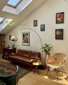 a living room filled with lots of furniture and decor on top of a hard wood floor