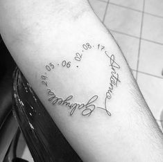 a black and white photo of a man's arm with his handwriting on it