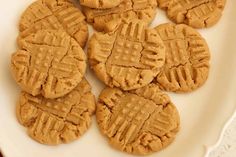 several peanut butter cookies on a white plate