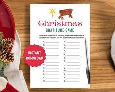 a printable christmas game is sitting on a table next to a plate and fork