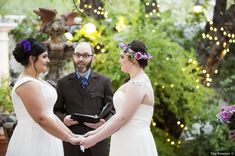 a man and woman standing next to each other holding hands