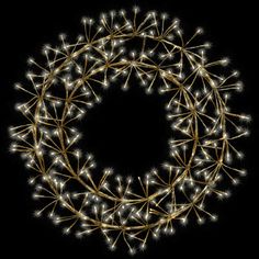 a wreath made out of lights on a black background