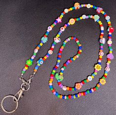 Adorable, fun, colorful lanyard. Perfect for teachers, nurses, or anyone looking for a colorful addition to their day. Multicolor Lanyards With Key Leash, Multicolor Lanyards With Round Beads And Key Leash, Multicolor Beaded Lanyard With Key Leash, Handmade Adjustable Multicolor Lanyards, Multicolor Handmade Craft Supplies For School, Handmade Multicolor Craft Supplies For School, Fun Multicolor Craft Supplies For Hobby, Fun Multicolor Lanyards For Gifts, Fun Multicolor Lanyards As Gifts