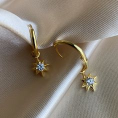 14K Gold plated 925 Sterling Silver Star hoop earrings. Minimalist style. Everyday jewelry made with love. ...............................DETAILS• 14K Gold Plated • 925 Sterling Silver • AAA Cubic Zirconia Stone• Also available in 14K White Gold...............................MEASURESHoop Diameter: 16mm (1.6cm) Charm Size:10mm (1cm) Celestial Gold Plated Tarnish Resistant Hoop Earrings, Celestial Gold-plated Tarnish Resistant Hoop Earrings, Celestial Gold-plated Tarnish-resistant Hoop Earrings, Celestial Style Gold-plated Yellow Gold Hoop Earrings, Celestial Style Yellow Gold Plated Hoop Earrings, Elegant Gold Hoop Earrings With Star Charm, Dainty Yellow Gold Huggie Earrings With Star Charm, Celestial Yellow Gold Tarnish-resistant Hoop Earrings, Celestial Tarnish-resistant Earrings For Everyday