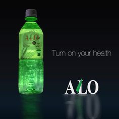 a bottle of alo on a black background with the words turn on your health