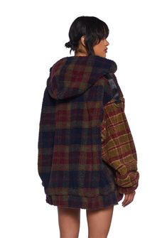 This fully lined jacket has a sherpa construction with a plaid design, side pockets, nylon strap detailing on the shoulders, o-ring hardware, an attached hood, and a front zipper closure. Hooded Sherpa Outerwear For Streetwear, Grunge Winter Jacket, Cute Winter Fits, Jacket With Fur Hood, Harajuku Jacket, Fur Lined Jacket, Current Mood Clothing, Street Style Outfits Casual, Sherpa Lined Hoodie