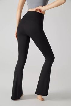 Lexi Black Flared Pant contains Lycra® elastane and conforms to your body shape. The flared trousers perfectly hide O-shaped and X-shaped legs, solve more leg shape troubles, and fully lengthen the leg lines. The simple version design can not only be worn out on the street, but also can be used as sports yoga pants. Come and choose a pair of soft and comfortable pants!  Full Length: Approx 105cm Materials: 81% Nylon, 19% Lycra® elastane Stretch Type: Very Stretchy Gentle Dry Clean Only Solid Color Stretch Bottoms With Flared Hem, Black Stretch Flares With Flared Hem, Stretch Flare Leggings, Solid Flare High Stretch Leggings, Black Stretch Full-length Flares, Solid Flare High-stretch Leggings, Solid Color High Stretch Flare Leggings, Black Stretch Full Length Flares, Black High Waist Stretch Flares