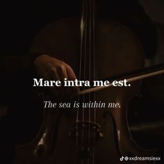 someone is playing the violin with their hand and has an interesting quote on it that says mare intra me est