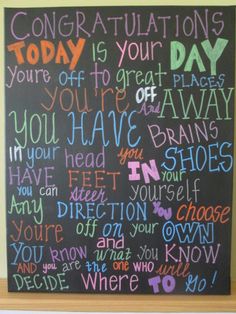 a chalkboard with words written on it in different colors and font, including the words congratulations today is your day