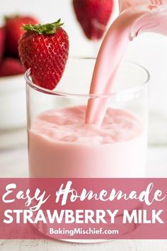 strawberry milk being poured into a glass with strawberries in the background