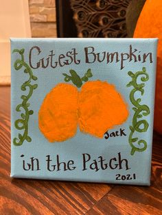 an orange painted on a canvas with the words, gutst pumpkin in the patch