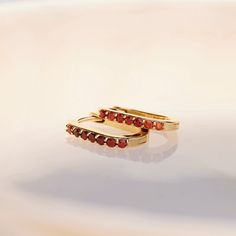 Beautiful deep red Mozambique Garnet hinged hoop earrings in solid 14k yellow gold make a great gift for any January birthday baby. #garnet #januarybirthstone #gemstonejewelry #garnetearrings #earrings #hoops #gemstonelover #goldearrings #birthstone #jewelry Gemstone Hoop Earrings, Tsavorite Garnet, Garnet Earrings, London Blue Topaz, Red Garnet, White Sapphire, Ear Jewelry, Jewelry Bags