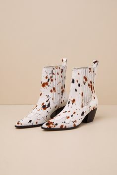 The Matisse Collins White Multi Speckle Calf Hair Leather Ankle Boots were made for walking with stylish confidence! Sleek, genuine calf hair leather (with a tan and black speckled cow-like print) shapes these pointed-toe boots that feature Western-inspired seaming. Elastic gusset panels accent the instep and outstep of the ankle-high shaft, while a pull tab at the back completes the slip-on silhouette. A classic stacked block heel lends the perfect cowgirl finish. 2. 5" stacked block heel. Ligh White Calf Hair Boots For Fall, Leopard Print Leather Pointed Toe Boots, Leopard Print Leather Boots With Pointed Toe, Leopard Print Pointed Toe Leather Boots, Calf Hair Boots With Round Toe For Fall, Calf Hair Ankle Boots For Fall, Trendy Leopard Print Leather Boots, Chic Leopard Print Leather Boots, Leopard Print Leather Ankle Boots