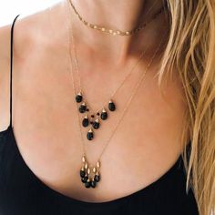 Glittering black spinel gemstones are hand wrapped in gold and suspended from 14k gold filled pieces beads.  This necklace is gorgeous to wear alone or layer with other pieces.PICTURED WITHBlack Spinel Wingspan Necklace :Gold Choker Wrap Necklace : http://ow.ly/xkFL306abdC...................................................................................................................• Measurements : Necklace is adjustable from 21"-24" in length.• Materials : Black spinel, 14k gold filled.• Cle Black Spinel Beaded Necklace For Gifts, Black Spinel Necklace With Black Beads For Gift, Gift Necklace With Black Spinel And Beads, Gift Black Spinel Necklace With Black Beads, Elegant Beaded Black Spinel Jewelry, Minimalist Beaded Onyx Jewelry, Minimalist Onyx Beaded Jewelry, Elegant Teardrop Black Bead Jewelry, Elegant Teardrop Black Beaded Jewelry