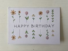 a happy birthday card with flowers on it