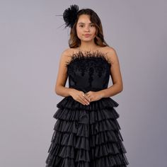 DETAILS: 2-piece set includes: adult size corset & full-length skirt Strapless satin corset with velvet damask pattern & gorgeous ostrich feathers Black multi-layered, multi tiered bridal tulle skirt Zippers in back Cotton lining Color may vary due to lighting on images Matching daughter dress also available! PRE ORDER & CUSTOM: Mommy items take on average 3-4 weeks to prepare and ship If you have a specific date you need this item by, please reach out to our team at info@ittybittytoes.com. For Daughter Dress, Suspenders Set, Satin Corset, Full Length Skirts, Ostrich Feathers, Damask Pattern, Model Pictures, Multi Layering, Damask