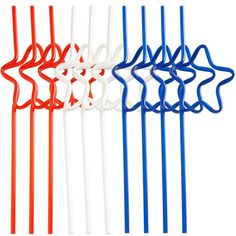 four different colored toothbrushes on white and blue sticks with holes in the middle