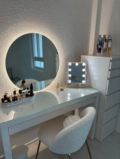 a white desk with a mirror and lights on it