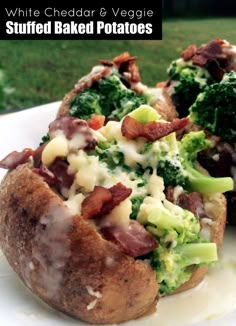 two baked potatoes with bacon, broccoli and cheese sitting on a white plate