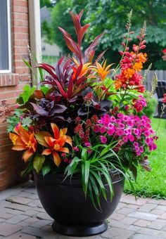 a large pot filled with lots of colorful flowers