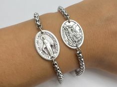 Religious bracelets with catholic saint medals from Medjugorje. For men, women or kids. Bracelet is made with extra loops so it is adjustable. Fits several sizes at once. Choose your size in dropdown menu and enter your saint medal in personalization tab. CONTACT US FOR SPECIFIC SIZE IF YOU NEED IT. Chain made out of quality steel. Will not rust or break. Medals made in Italy. With great detail and engraving: St Michael Archangel, St Benedict, Miraculous Medal, Divine Mercy, Virgin Mary, Padre P St Peregrine, Saint Medals, Michael Archangel, Kids Bracelet, Custom Gift Cards, Catholic Saint, Protection Jewelry, Belly Jewelry, Saint Michael