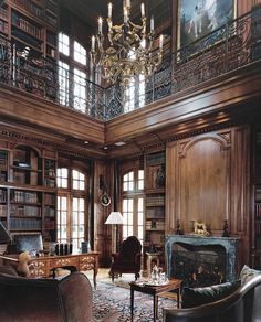 a living room filled with furniture and a chandelier