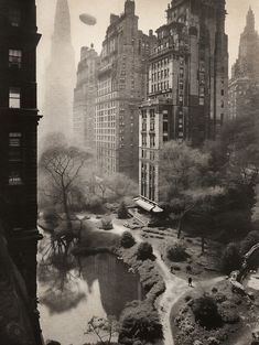 an old black and white photo of a park in new york city with skyscrapers